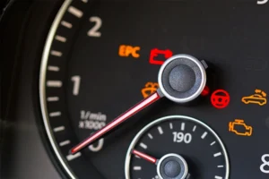 close-up of a vehicle's dashboard with multiple warning lights illuminated 